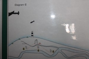 A picture on display in the old Bomb Ballistics building showing testing near the lighthouse